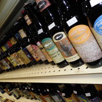 a few dogfishhead bottles of beer on shelf